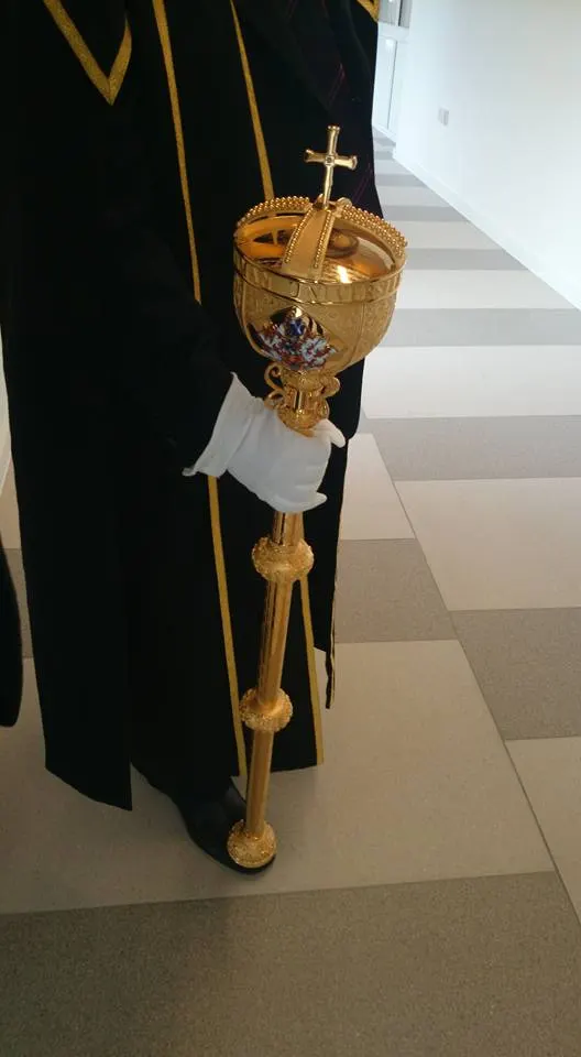 Ceremonial civic mace carried by an official in robes