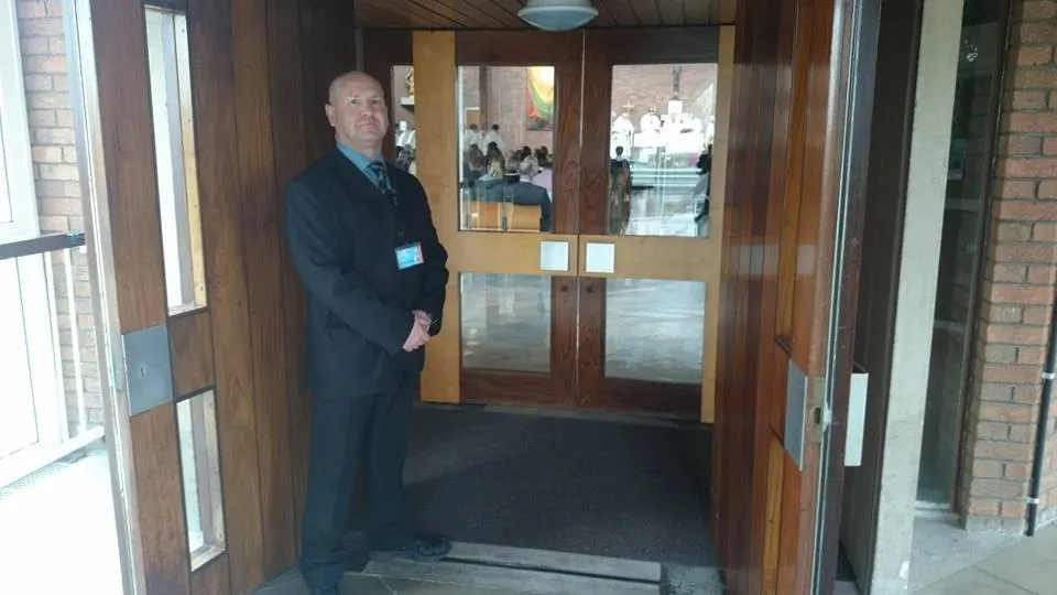 Cofton Security officer on duty in a building doorway
